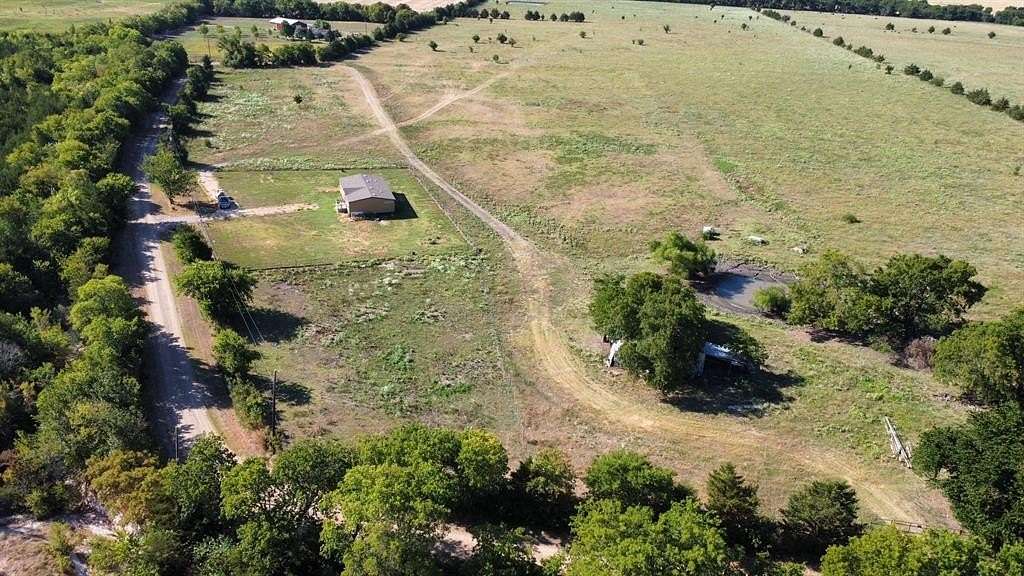 12.664 Acres of Land with Home for Sale in Pecan Gap, Texas