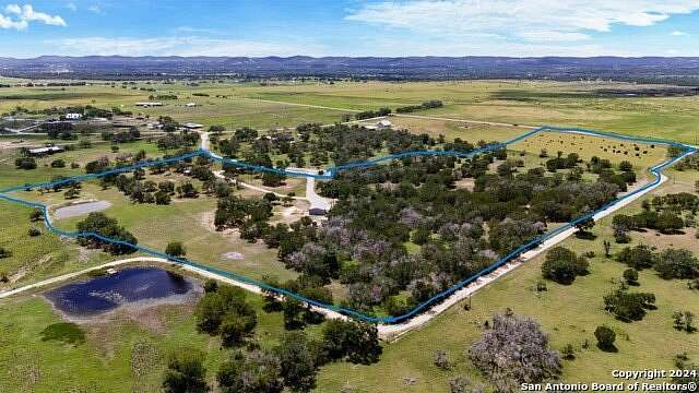 24.47 Acres of Land with Home for Sale in Bandera, Texas