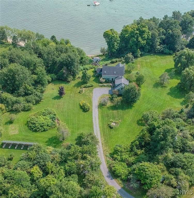 7.55 Acres of Land with Home for Sale in Three Mile Bay, New York