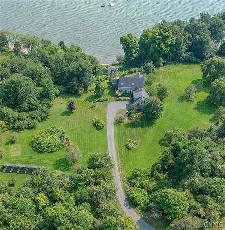 7.55 Acres of Land with Home for Sale in Three Mile Bay, New York