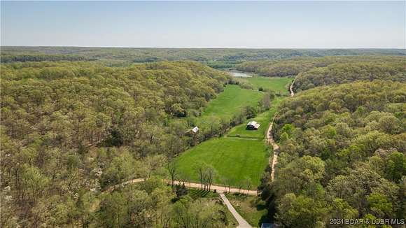 243 Acres of Recreational Land with Home for Sale in Kaiser, Missouri