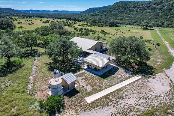 51.15 Acres of Agricultural Land with Home for Sale in Leakey, Texas