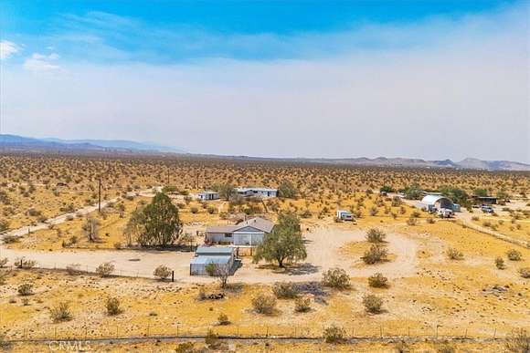 5 Acres of Residential Land with Home for Sale in Landers, California