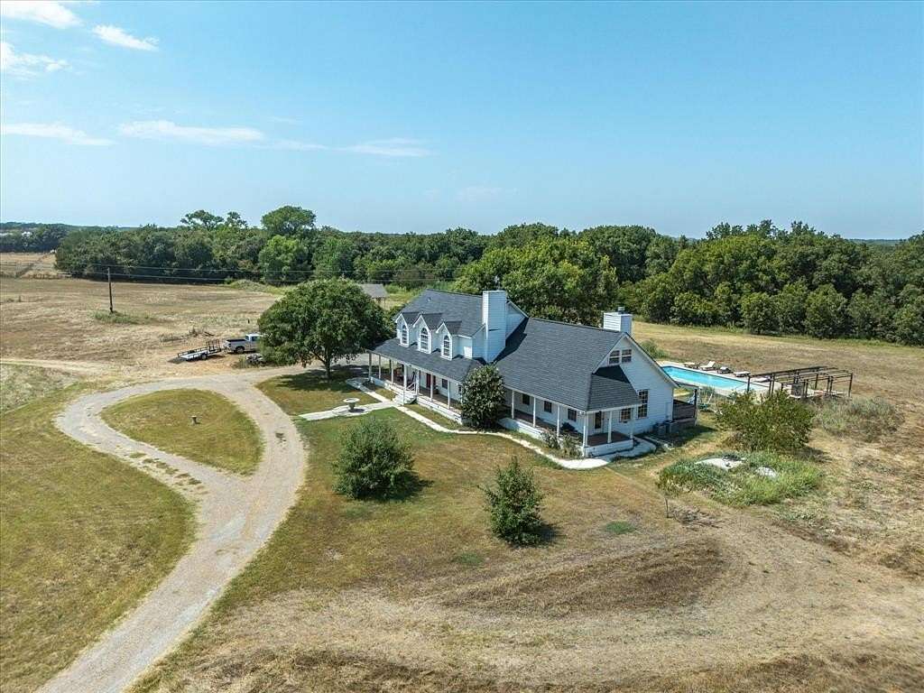 21.4 Acres of Agricultural Land with Home for Sale in Paradise, Texas