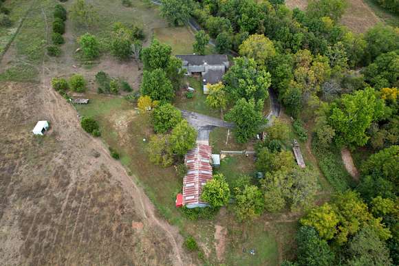 10 Acres of Land with Home for Sale in Fair Grove, Missouri