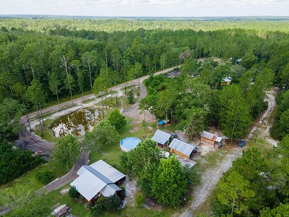 7.77 Acres of Residential Land with Home for Sale in Stockton, Georgia