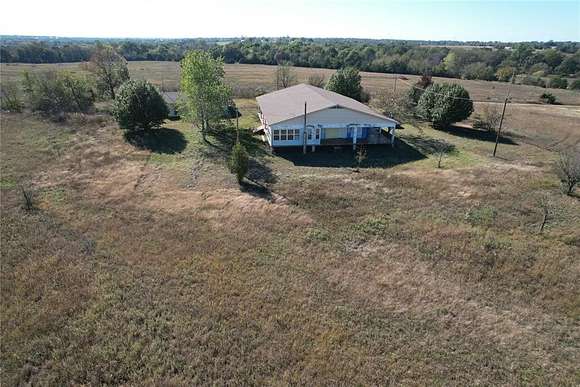 10 Acres of Residential Land with Home for Sale in Konawa, Oklahoma