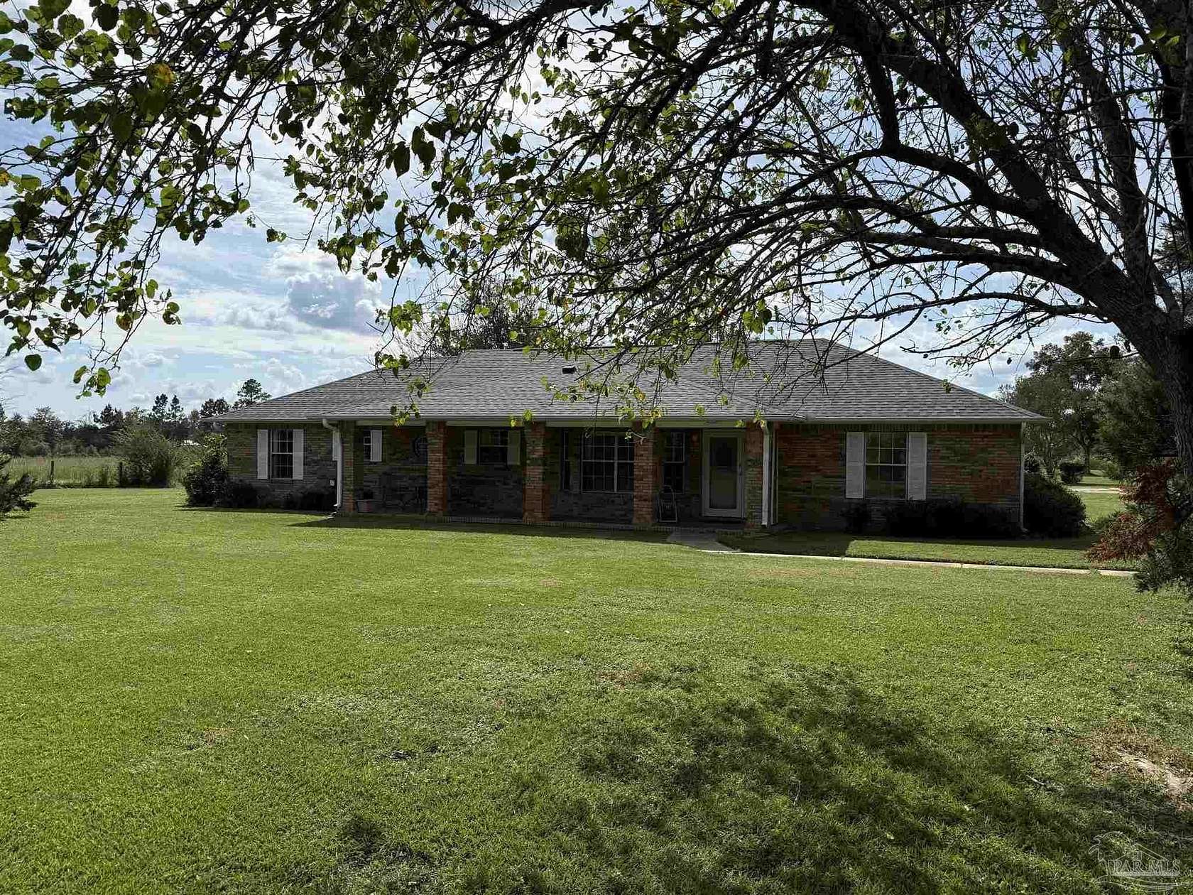 30.7 Acres of Agricultural Land with Home for Sale in Molino, Florida