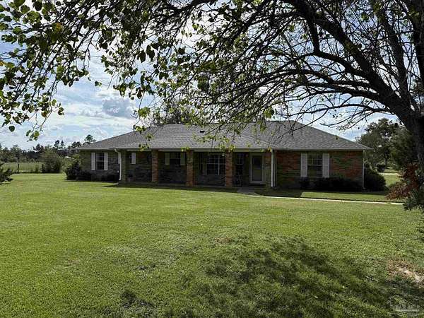 30.7 Acres of Agricultural Land with Home for Sale in Molino, Florida