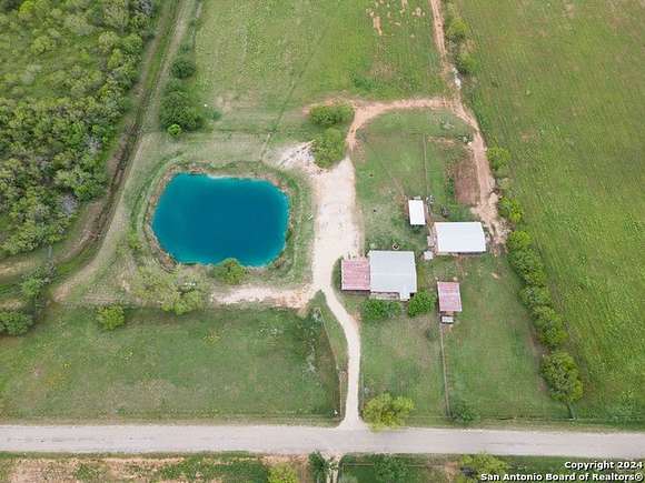 19.79 Acres of Land with Home for Sale in Devine, Texas