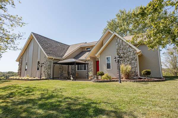 30 Acres of Agricultural Land with Home for Sale in Nixa, Missouri