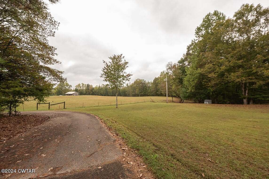 8.3 Acres of Residential Land with Home for Sale in Lexington, Tennessee