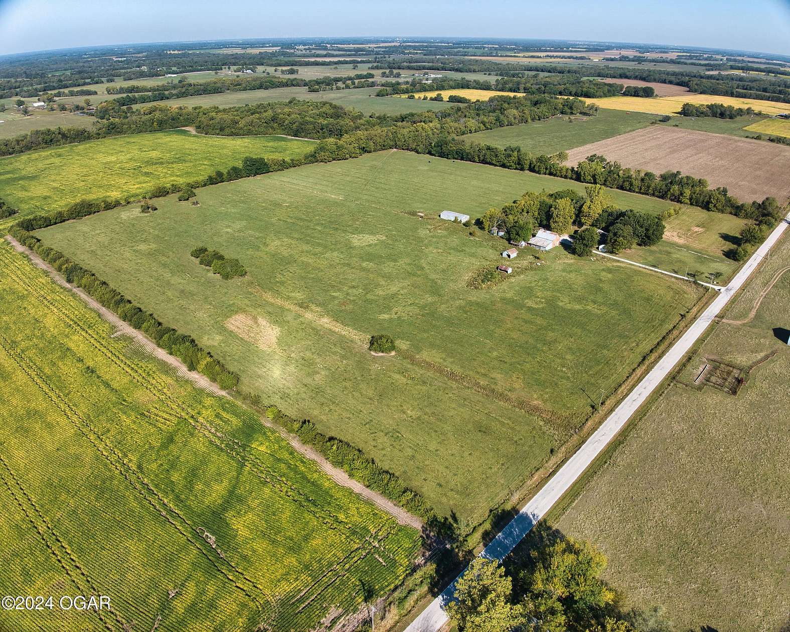 39 Acres of Agricultural Land with Home for Sale in Carthage, Missouri