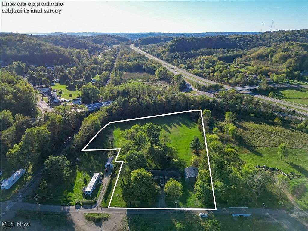 3.94 Acres of Residential Land with Home for Auction in Uhrichsville, Ohio