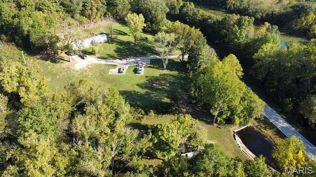 141 Acres of Land with Home for Sale in Mill Spring, Missouri