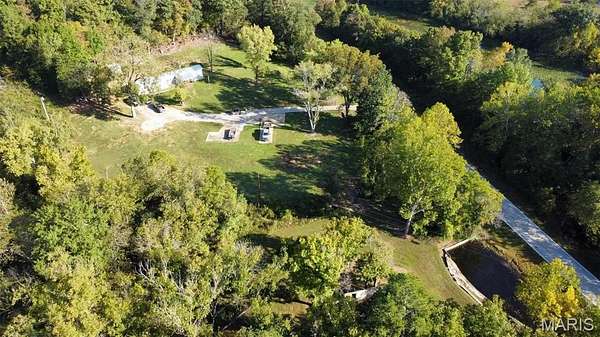 141 Acres of Land with Home for Sale in Mill Spring, Missouri