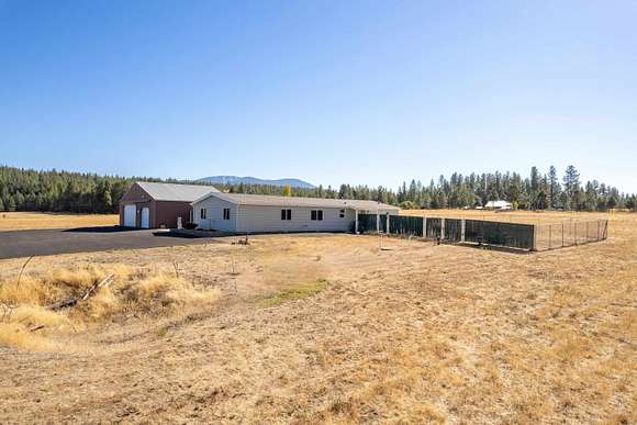 9.9 Acres of Residential Land with Home for Sale in Elk, Washington