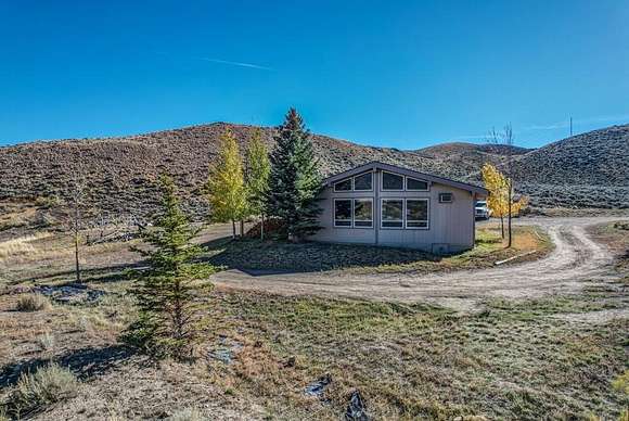 5 Acres of Residential Land with Home for Sale in Cody, Wyoming