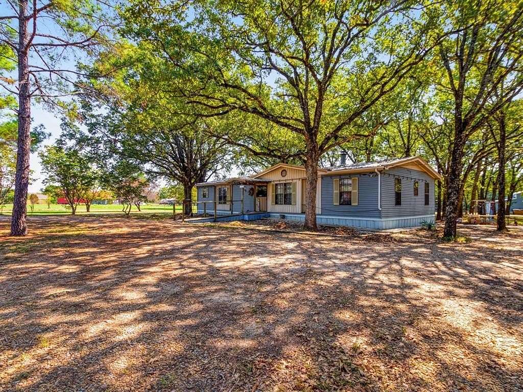 5.01 Acres of Residential Land with Home for Sale in Quinlan, Texas