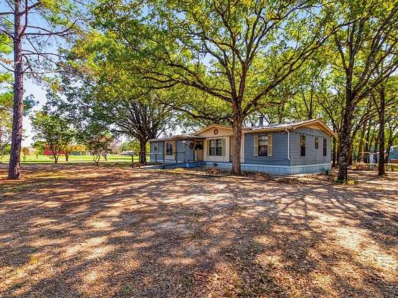 5.01 Acres of Residential Land with Home for Sale in Quinlan, Texas