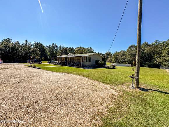 2.4 Acres of Residential Land with Home for Sale in Poplarville, Mississippi