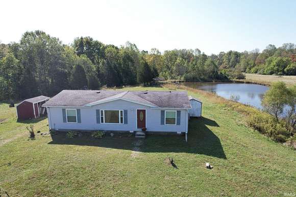 23 Acres of Land with Home for Auction in Milan, Indiana