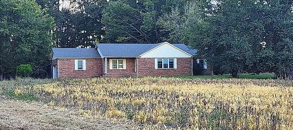 9.7 Acres of Residential Land with Home for Sale in Paris, Tennessee