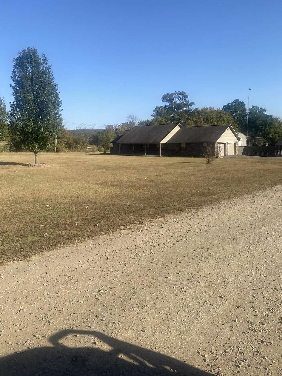 11.73 Acres of Land with Home for Sale in Russellville, Arkansas