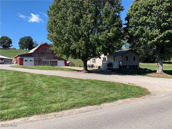 8.477 Acres of Residential Land with Home for Auction in Sugarcreek, Ohio