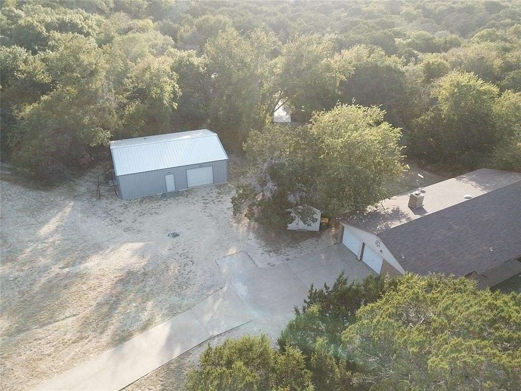 5.77 Acres of Residential Land with Home for Sale in Granbury, Texas