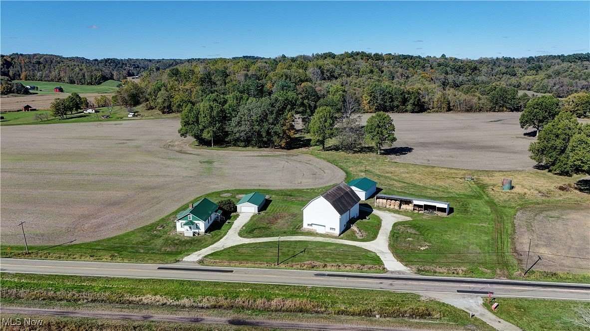 7.4 Acres of Residential Land with Home for Auction in Uhrichsville, Ohio