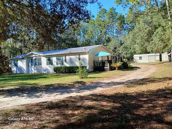 2.21 Acres of Residential Land with Home for Sale in Dunnellon, Florida