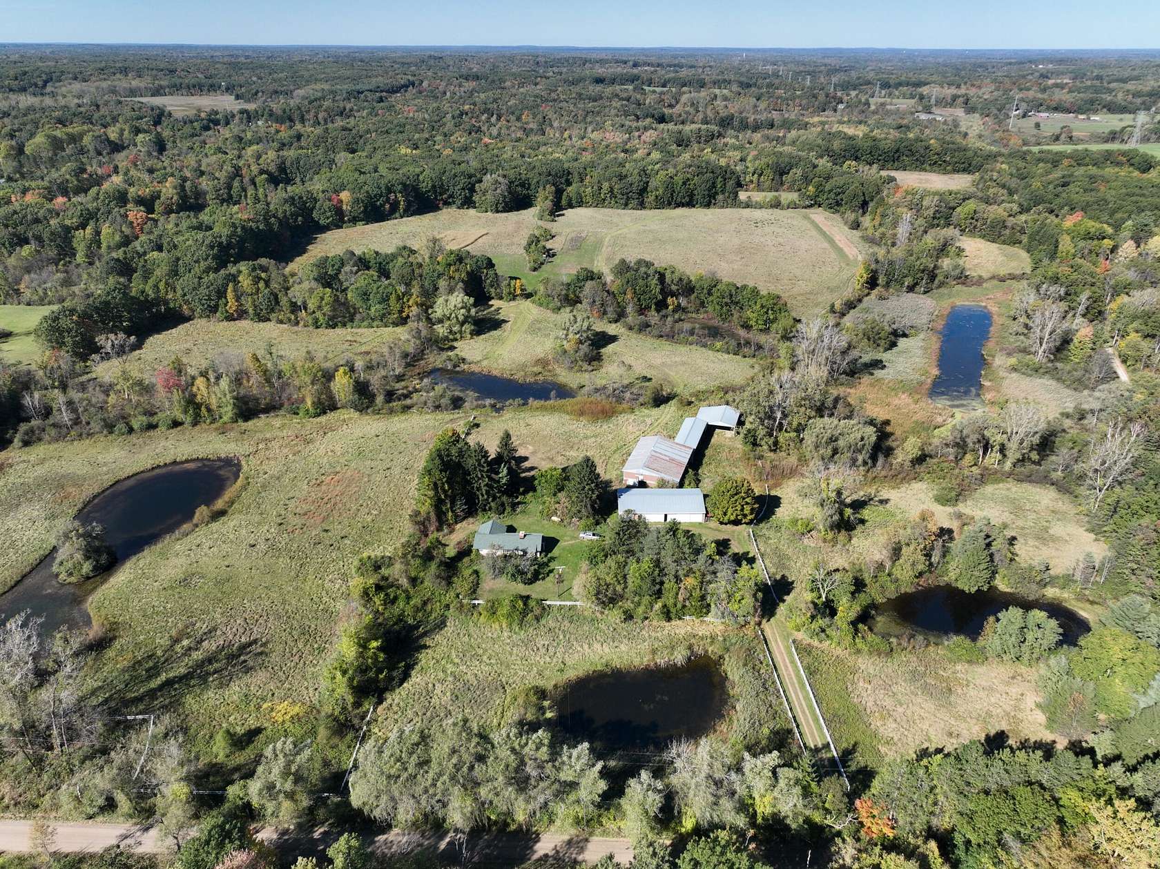 92 Acres of Recreational Land with Home for Sale in Leonard, Michigan