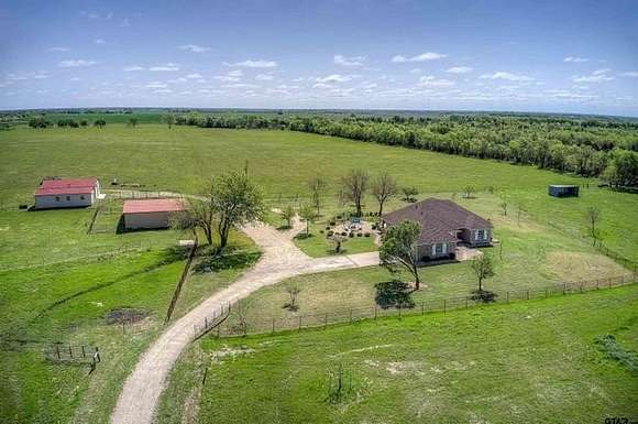 74.12 Acres of Agricultural Land with Home for Sale in Cooper, Texas