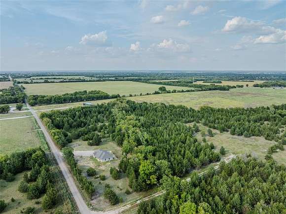 10 Acres of Residential Land with Home for Sale in Paris, Texas