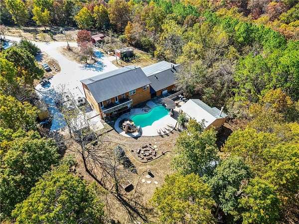 7.83 Acres of Land with Home for Sale in Garfield, Arkansas