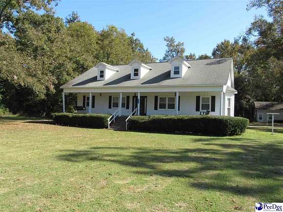 5.6 Acres of Residential Land with Home for Sale in Effingham, South Carolina