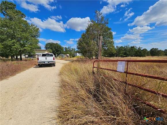 5.472 Acres of Residential Land with Home for Sale in Paige, Texas