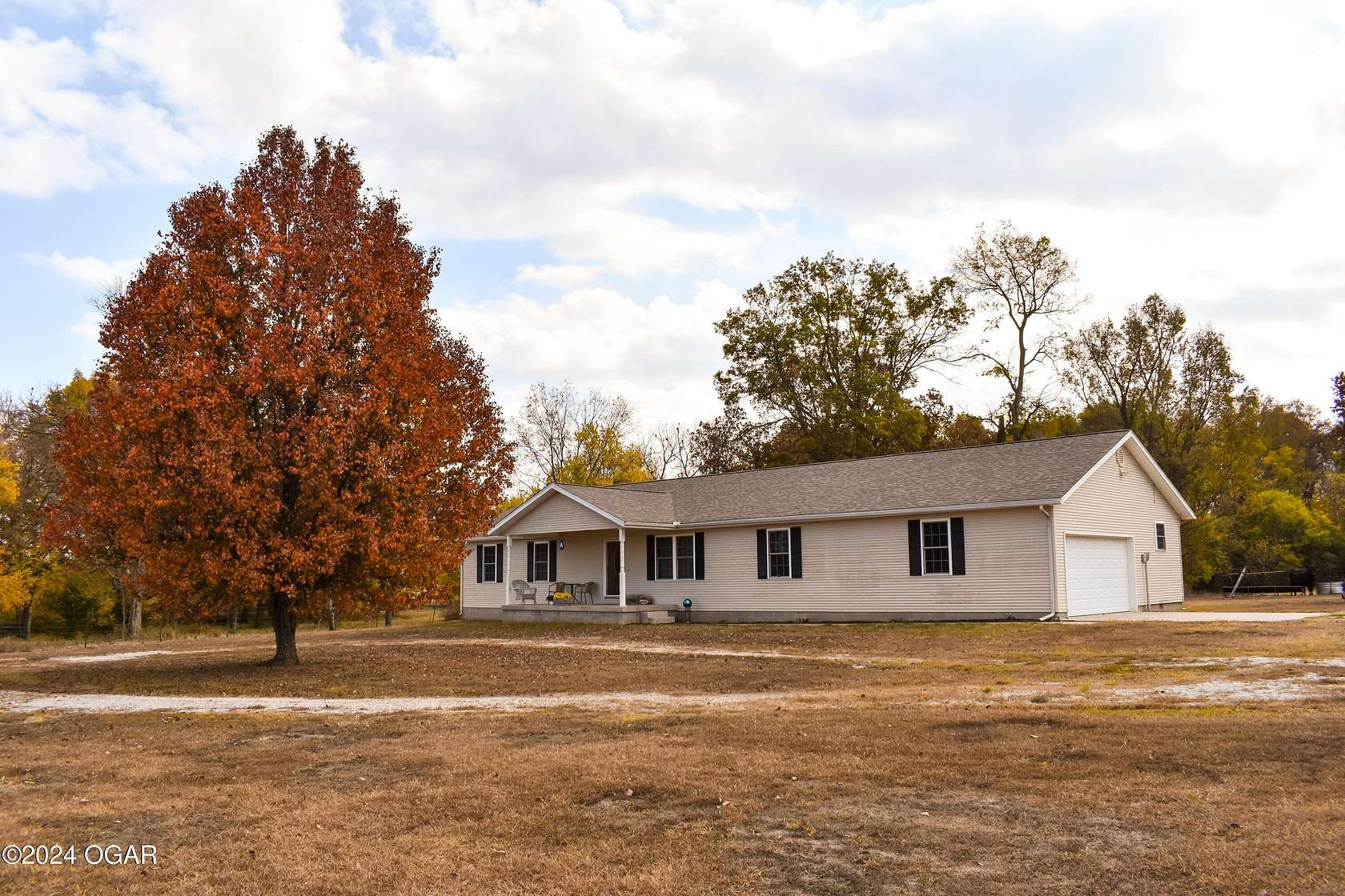 80 Acres of Agricultural Land with Home for Sale in Carthage, Missouri