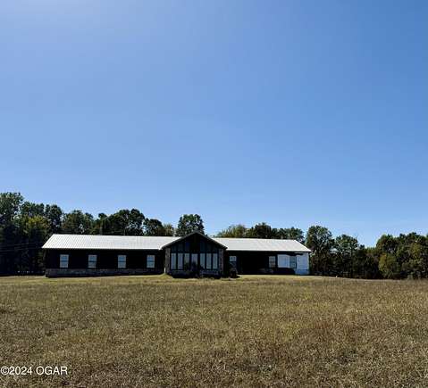 40 Acres of Agricultural Land with Home for Sale in Stella, Missouri