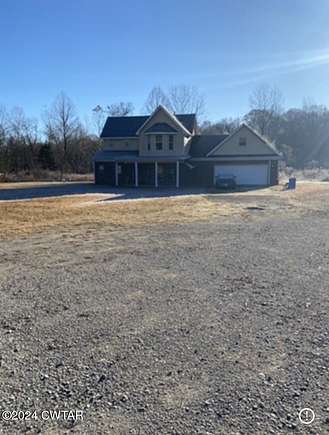 2.3 Acres of Residential Land with Home for Sale in Beech Bluff, Tennessee