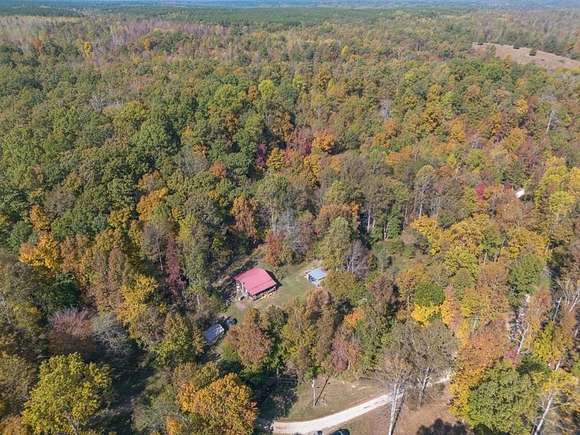 60.11 Acres of Land with Home for Sale in Holladay, Tennessee