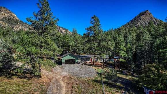 5.2 Acres of Residential Land with Home for Sale in Pagosa Springs, Colorado