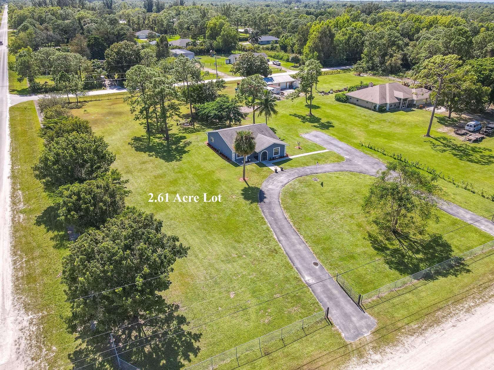 2.606 Acres of Residential Land with Home for Sale in The Acreage, Florida