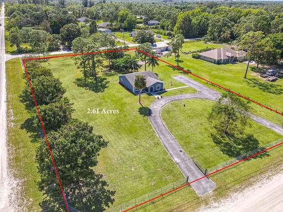 2.606 Acres of Residential Land with Home for Sale in The Acreage, Florida