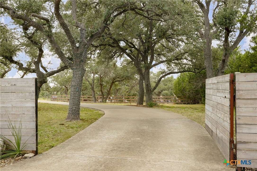 6.96 Acres of Residential Land with Home for Sale in Wimberley, Texas