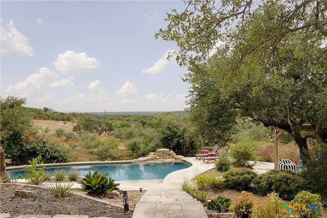 6.96 Acres of Residential Land with Home for Sale in Wimberley, Texas