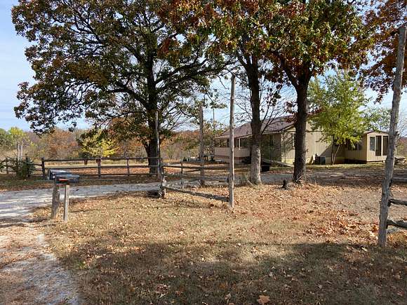 17 Acres of Recreational Land with Home for Sale in Deepwater, Missouri