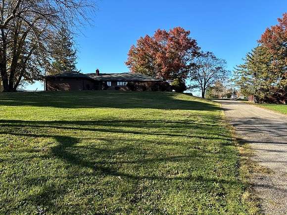 9.84 Acres of Land with Home for Auction in Lucasville, Ohio