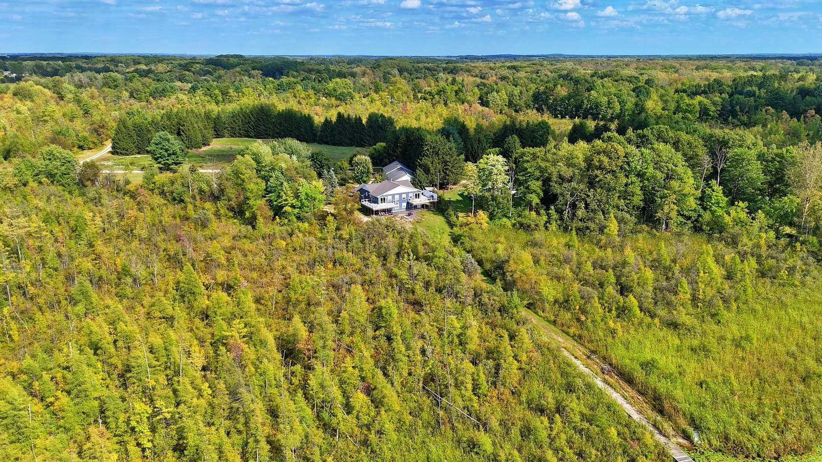 23.5 Acres of Recreational Land with Home for Sale in Pierson, Michigan